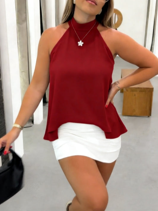 A Women'S Halter Top Showcases The Trendy Summer Fashion